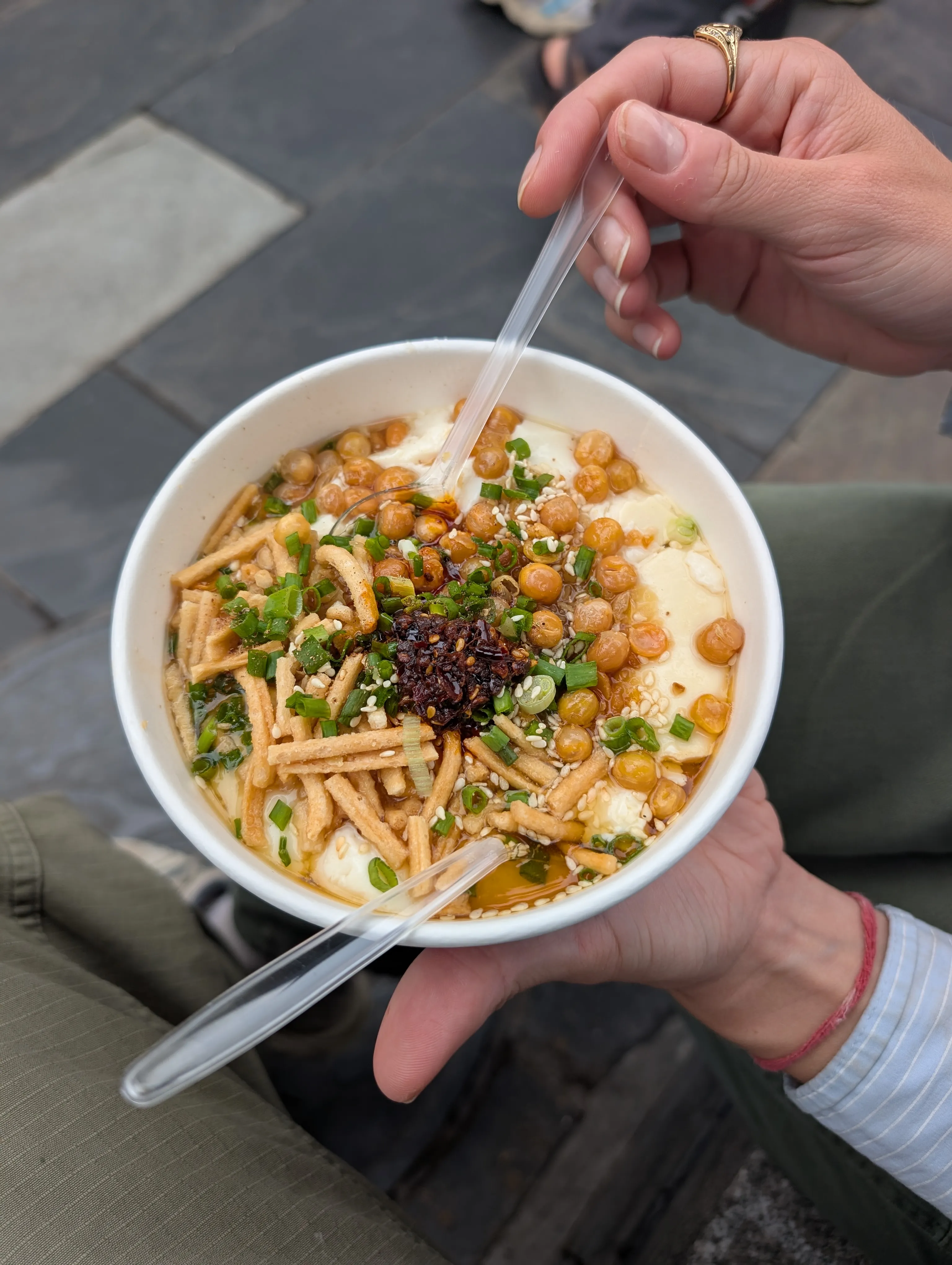 Silken tofu topped with soy sauce, sesame oil, chili crisp, and scallions.