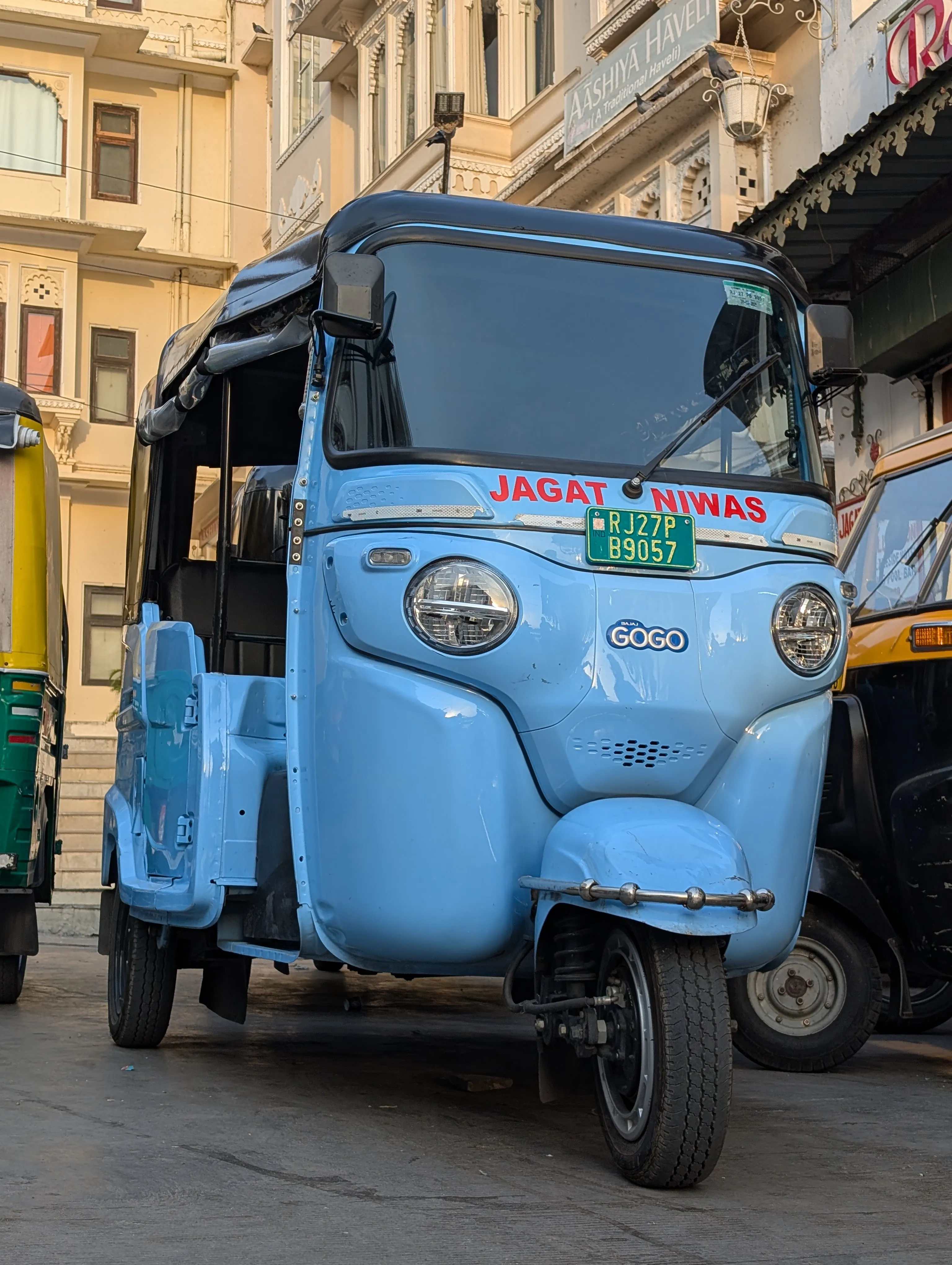 A powder-blue electric tuk-tuk in Udaipur.